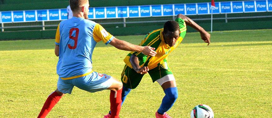 Team SVG tries to dribble pass a defender on the way to the goal