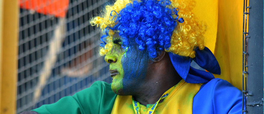 Patriotism at its finest! A spectator proudly displays St. Vincent's national colours.